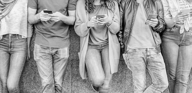 Group of friends using their smart mobile phones - Millennial yo